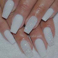 white acrylic nails with glitter on them