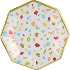 an octagonal paper plate with multicolored geometric shapes on white and gold rims