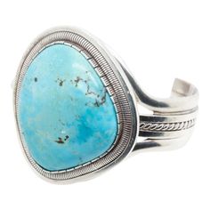 A fine Navajo silver and turquoise cuff bracelet.  Center set with a large turquoise cabochon.  Signed to the reverse for Sterling / WV for William Vandever.  Simply a wonderful piece of Old Pawn silver!  Date: 20th Century  Overall Condition: It is in overall good, as-pictured, used estate condition. There is some light edge wear, some fine and light surface scratches, and other signs of light wear consistent with age.  Fineness: Marked Sterling for silver fineness.  Marks: Signed to the revers Turquoise Bracelet Cuff, Turquoise Cuff, Silver Turquoise, Bracelet Sizes, Vintage Signs, Santa Fe, Cuff Bracelet, 20th Century, Cuff Bracelets