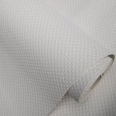 the white textured fabric is very soft and comfortable for bedding or wall coverings