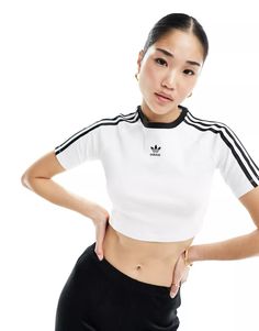 adidas Originals 3 stripe baby cropped T-shirt in white | ASOS Crop Top Blanco, Adidas Crop Top, Packing Clothes, Jersey Outfit, Cropped T Shirt, Sporty Chic, Crop Tshirt, Adidas Originals, Stylish Outfits