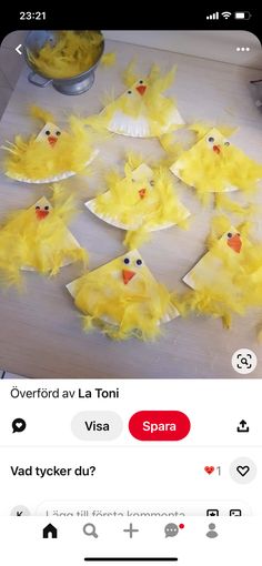 a bunch of yellow chicks sitting on top of a table next to some paper plates