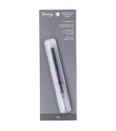 the packaging for an empty toothbrush is packaged in white and purple paper with black trim