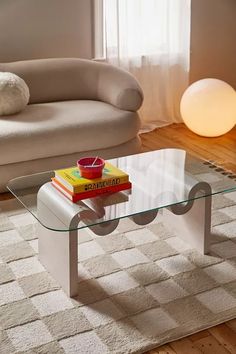 a glass table with some books on it