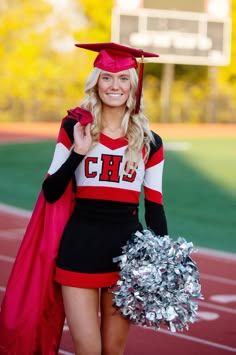 a woman in a cheerleader outfit is holding a pom - pom and posing for the camera