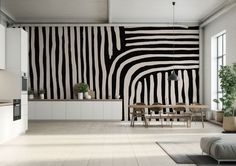 a living room filled with furniture and a zebra print wall