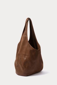 Oversized, unstructured hobo bag with a large top handle, in soft leather. 100% Leather Interior Pocket Length: 12” Width: 18” Shoulder Strap: 20" Shoulder Strap Drop: 14.5" Made in Peru Hobo Bag Outfit, Hobo Tote Bag, Womens Designer Bags, Tall Leather Boots, Tote Bag Pattern, Rachel Comey, Bag Dress, Large Bag, Leather Hobo