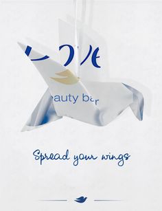 an advertisement for a beauty bar with a bird on it's back and the words, spread your wings