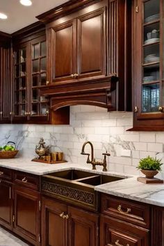 a kitchen with wooden cabinets and marble counter tops