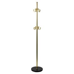 a gold coat rack with three hooks and two coats on the top, in front of a white background