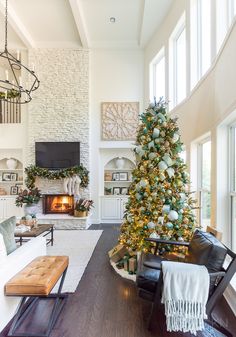 a living room with a christmas tree in the corner