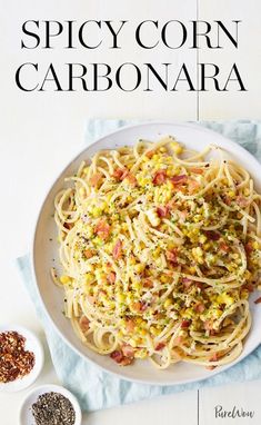 the cover of spicy corn carbonara is shown on a plate with spices and seasonings