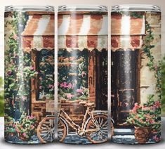 three cans with cross stitch designs on them