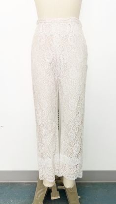 Mod 1960s handmade lace pant set - Skinny strap white lace tunic with sweetheart neckline and scalloped hem. Metal zipper on the back with hook-and-eye closure at top. Fully lined with blush fabric and nude overlay. - Cropped straight leg high-rise white lace pants with scalloped hem. Side metal zipper and hook-and-eye closure on tab. Fully lined in blush fabric with nude overlay. Label: Fashioned by Ruth Steele Elegant White Bottoms With Lace Patchwork, Summer Lace Pants With Lace Trim, Chic Scalloped Lace Bottoms, Chic Lace Bottoms With Scalloped Lace, Chic Lace Bottoms With Scalloped Detail, Elegant Scalloped Lace Bottoms, Elegant Wedding Bottoms With Delicate Lace, Chic White Scalloped Lace, Fitted White Lace Pants