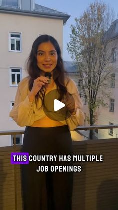 a woman standing in front of a balcony holding a mirror with the words, this country has multiple job openings