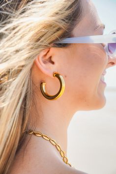 The Waverly Hoops are the perfect accessory for any outfit, whether it be casual or more sophisticated! They are a plain, shiny gold hoop with an opening in the back, and a post back. They are lightweight, have an approximately 1.5" diameter, are gold plated, and are lead and nickel compliant. Modern Gold Hoop Earrings For Summer, Chic Gold Hoop Earrings For Summer, Trendy Gold Hoop Earrings For Summer, Minimalist Gold Hoop Earrings For Summer, Chic Gold Hoop Earrings For Everyday, Trendy Gold Hoop Earrings For Everyday, Gold Jewelry For Everyday Summer Wear, Everyday Gold Jewelry For Summer, Everyday Summer Gold Jewelry