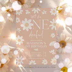 a birthday card with daisies and lights in the background on a light colored surface