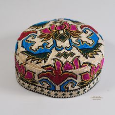 This beautiful colourful ethnic skull cap is cross-stitched in the entire surface. The stitches are so fine that a magnifying glass is needed to see them clearly. Every mosaic has one meaning. A flower at the top of the skullcaps - symbols of health. Bindweed at the bottom of skullcap - the richness and vitality.    Inside of hat made of cotton, which make you feel comfortable and very soft to wear. The hat is easy to carry since it is can be foldable when you are in travel or in outdoor.  Price Traditional Multicolor Hat One Size Fits Most, Multicolor Cap For Festivals, Traditional Multicolor Hats For Festivals, Traditional Handmade Hat As Gift, Traditional Multicolor Woven Hat, Handmade Traditional Hat As Gift, Traditional Multicolor Festival Hats, Artisan Multicolor Hats As Gifts, Afghan Wedding