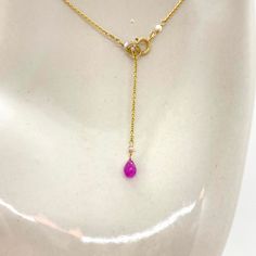 "Wire, Chain & Clasp: 14k Gold Stones: Pink Sapphires (approx. 3.5mm), Freshwater Pearls (approx. 1mm x 2mm), 18k Gold Daisy (approx. 2mm), 18k Gold Loop (approx. 5mm) Beads: Antique Italian Glass (approx. 1mm) Necklace Length: approx. 17\" Backdrop: Sapphire & Antique Italian Beads Backdrop Length: 1.6\" ------------------------------------------------------------ Let me know if you have any questions! *Size adjustable at client's request 693" Yellow Gold Lariat Jewelry With Pearl Chain, Elegant Rose Gold Jewelry With Gemstone Beads, Gold Briolette Single Strand Jewelry, Yellow Gold Pearl Chain For Jewelry Making, Yellow Gold Briolette Gemstone Drop Necklace, Rondelle Pearl Chain Jewelry As Gift, Gold Teardrop Pearl Necklace With Gemstone, Gold Akoya Pearl Necklace With Gemstone, Gold Briolette Pearl Necklace