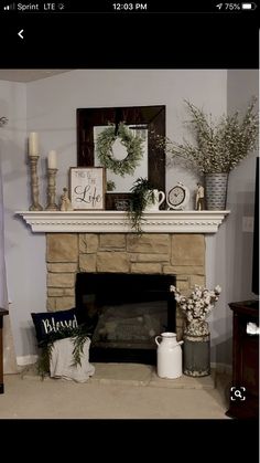 a living room filled with furniture and a fire place in front of a flat screen tv