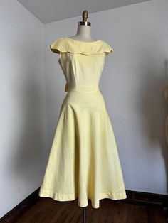 Gorgeous yellow cotton dress from the 1940s. This dress features a dramatic collar, fitted bodice and waistline that gets tied in the back or front with apron ties, and a simple long skirt. Metal zipper on the side.  Label: none  Measurements: { small } Bust: 36" Waist: 26" Hips: open Length: 48" Condition: nearly excellent vintage condition - in some lighting I'm kind of convinced there's a hint of color variance to the tone of yellow but not really noticeable. small mark on the skirt as shown. Simple Long Skirt, Yellow Cotton Dress, Pin Up Princess, Dramatic Collar, 1940 Dress, Yellow Vintage Dress, 20 Off Sale, 1940s Dresses, 1940s Fashion