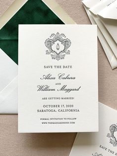 the wedding stationery is laid out on top of an envelope