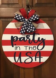 a patriotic door hanger that says party in the usa