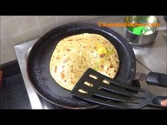 a skillet with a tortilla in it and a spatula next to it