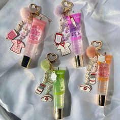 These keychains are a great way to accessorize while keeping lip gloss handy at all times!  * Nursing & healthcare inspired charms * Gold metals with pearl accents Various colors available! Lip Gloss With Charms, Keychain Lipgloss, Capri Party, Nursing Aesthetic, Charm Necklace Diy, Nursing Fun