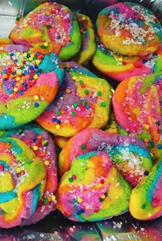 there are many colorful donuts with sprinkles on them