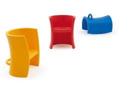 three different colored plastic chairs sitting next to each other in front of a white background