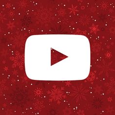 a red background with snowflakes and a white play button