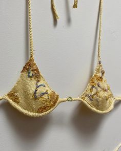 Ready for GRACE GUI SS24? Bikini set knit with 100% botanically dyed silk yarn, embroidered with wild foraged silk cocoons, beaded with 100% sea glass, felted with 100% tussah silk, topped off with removable underwire for support, and a sweet 100% genuine Jade pendant in the middle. #GRACEGUISS24 #BotanicalSilk #EmbroideredBikini #WildForagedCocoons #SeaGlassBeaded #TussahSilk #nycfashion#EcoFashion #SustainableStyle #JadePendant #HandcraftedSwimwear #HandmadeSwimwear#naturaldyes #nyc Knitted Swimsuit Bikinis, Beaded Swimsuit, Beaded Clothes, Handmade Bikinis, Cowboy Aesthetic, Designer Bikinis, Ibiza Outfits, Textiles Projects, Swimsuit Brands