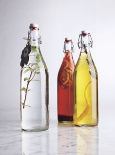 three bottles with different types of liquid in them