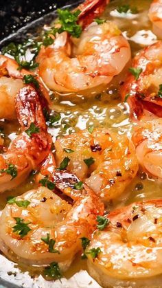 cooked shrimp with parsley in a skillet ready to be used as an appetizer