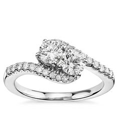 an oval shaped diamond engagement ring with double halos