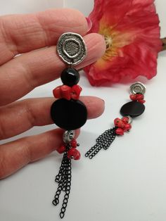 Beautiful very long earrings, created from various materials in red and black: red coral, black agate, resin elements, aluminum chain. The earrings are important and eye-catching, but at the same time they are light and comfortable to wear. The contrast between black and red make these earrings very elegant, very beautiful in summer with a low-cut dress. They recall the sea, the sun... for those who love nature. A beautiful gift for her. All jewels are delivered in a decorated box, ready to be given as a gift to your loved one. How to take care of your jewellery: put on your beauty products (cosmetics, perfumes, ...) before wearing your precious jewel. Clean your jewelry with a soft cloth after wearing. Don't use water. Make sure you store your jewelry separately to avoid scratching it. St Red Natural Stone Drop Earrings, Red Natural Stones Drop Earrings, Black Beads Dangle Earrings Gift, Black Beaded Dangle Earrings Gift, Black Beaded Dangle Earrings For Gifts, Red And Black Beaded Drop Earrings, Unique Red Earrings With Natural Stones, Black Bead Drop Earrings Jewelry Gift, Black Bead Drop Earrings As Gift