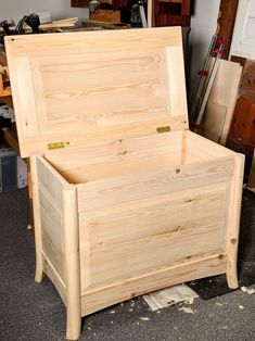 a large wooden box sitting on top of a floor