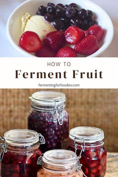 jars filled with fruit sitting on top of a table