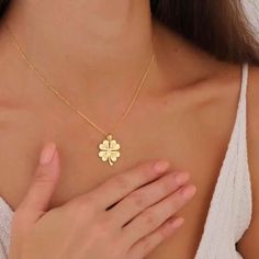 Add a little bit of magic to your everyday look with our Gold Clover Leaf Necklace! This charming four-leaf clover is not just a symbol of beauty, but also of luck, making it the perfect accessory for those who love timeless elegance. Whether you're heading to a special occasion or want to enhance your daily style, this stunning gold shamrock pendant is sure to turn heads. Gold Plated Flower Pendant Jewelry For Wedding, Gold Tarnish-resistant Jewelry As A Gift For Her, Gold Flower Pendant Jewelry For Wedding, Dainty Flower Pendant Jewelry For Good Luck, Dainty Good Luck Jewelry With Flower Pendant, Spiritual 14k Gold Jewelry For Anniversary, Tarnish-resistant Jewelry For Mother's Day Gift, Gold Wedding Jewelry Gift, Mother's Day Tarnish Resistant Jewelry Gift For Her