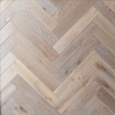 an image of wood flooring that looks like herringbones