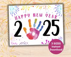 a happy new year card with fireworks and handprints on the front, reads 25 cents