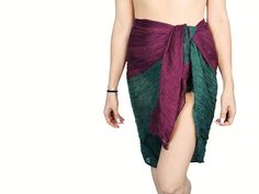 Add a splash of color to your beachwear with our Womens Beach Pareo Sarong! This vibrant, multi-colored bikini cover-up is perfect for your summer wardrobe. Made from ultra-light, transparent cotton, this sarong is a versatile accessory that can be styled in multiple ways - wear it as a head wrap, neck scarf, bikini cover, or even as a wrap skirt. Measuring approximately 180 x 75 cm (70" x 30"), it's the ideal size for a beach wrap or swimsuit cover-up. Our pareo sarong is printed with a beautif Bohemian Multicolor Sarong For Swimming, Multicolor Sarong For Pool And Beach Season, Multicolor Sarong For Beach Season And Pool, Green Tropical Swimwear For Festival, Bohemian Green Swimwear For Festivals, Purple Beach Cover-up Swimwear, Bohemian Green Sarong For Pool, Green Summer Sarong For Swimming, Green Bohemian Swimwear For Beach