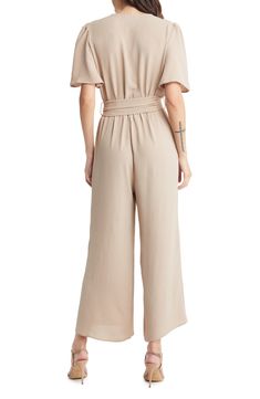 An updated alternative to classic officewear, this sleek jumpsuit features a flattering surplice neck and waist sash for an extra touch of elegance. 56" length Front button closure Surplice V-neck Short sleeves Removable tie belt Partially lined 100% polyester Hand wash, line dry Made in the USA of imported fabric Women's Clothing Casual V-neck Belted Jumpsuits And Rompers, Elegant V-neck Jumpsuits And Rompers With Tie Waist, Formal Solid Belted Jumpsuit, Chic Belted Short Sleeve Jumpsuits And Rompers, Elegant Belted Solid Jumpsuits And Rompers, Chic Belted Short Sleeve Jumpsuit, Chic Belted Jumpsuits And Rompers With Short Sleeves, Chic Belted Jumpsuit With Short Sleeves, Chic Belted Jumpsuits And Rompers