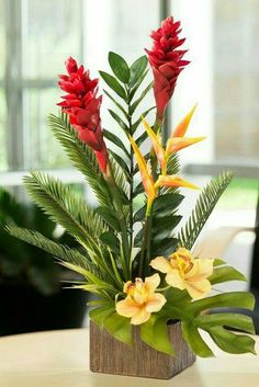 a vase filled with flowers on top of a table