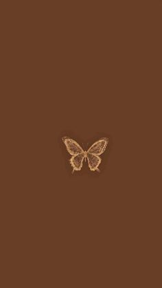 a brown background with a small butterfly on it's back and one wing extended