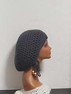 Step up your style game with this handmade charcoal crochet dreadlock tam with drawstring slouchy hat. This unisex beanie is perfect for casual occasions and comes in size L. The acrylic material and crochet fabric type provide a stretchy and comfortable fit, making it perfect for winter, fall, and spring seasons. The hat is handmade with love in the United States and features a solid pattern, reggae character, and hippie/boho theme. It also comes with a drawstring for a customizable fit. This hat is perfect for Christmas and outdoor activities and is sure to make a statement Casual Gray Crochet Hat One Size, Adjustable Gray Crochet Beanie Hat, Casual Gray Crochet Hat, Handmade Adjustable Gray Crochet Hat, Adjustable Handmade Gray Crochet Hat, Handmade Gray Crochet Hat Casual Style, Handmade Casual Gray Crochet Hat, Casual Handmade Gray Crochet Hat, Hippie Love