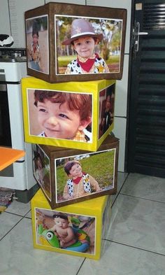 a stack of three boxes with pictures on them