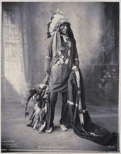 an old black and white photo of a native american man