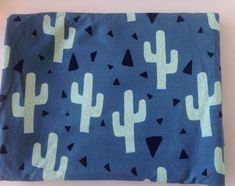 a blue and yellow cactus print pillow case